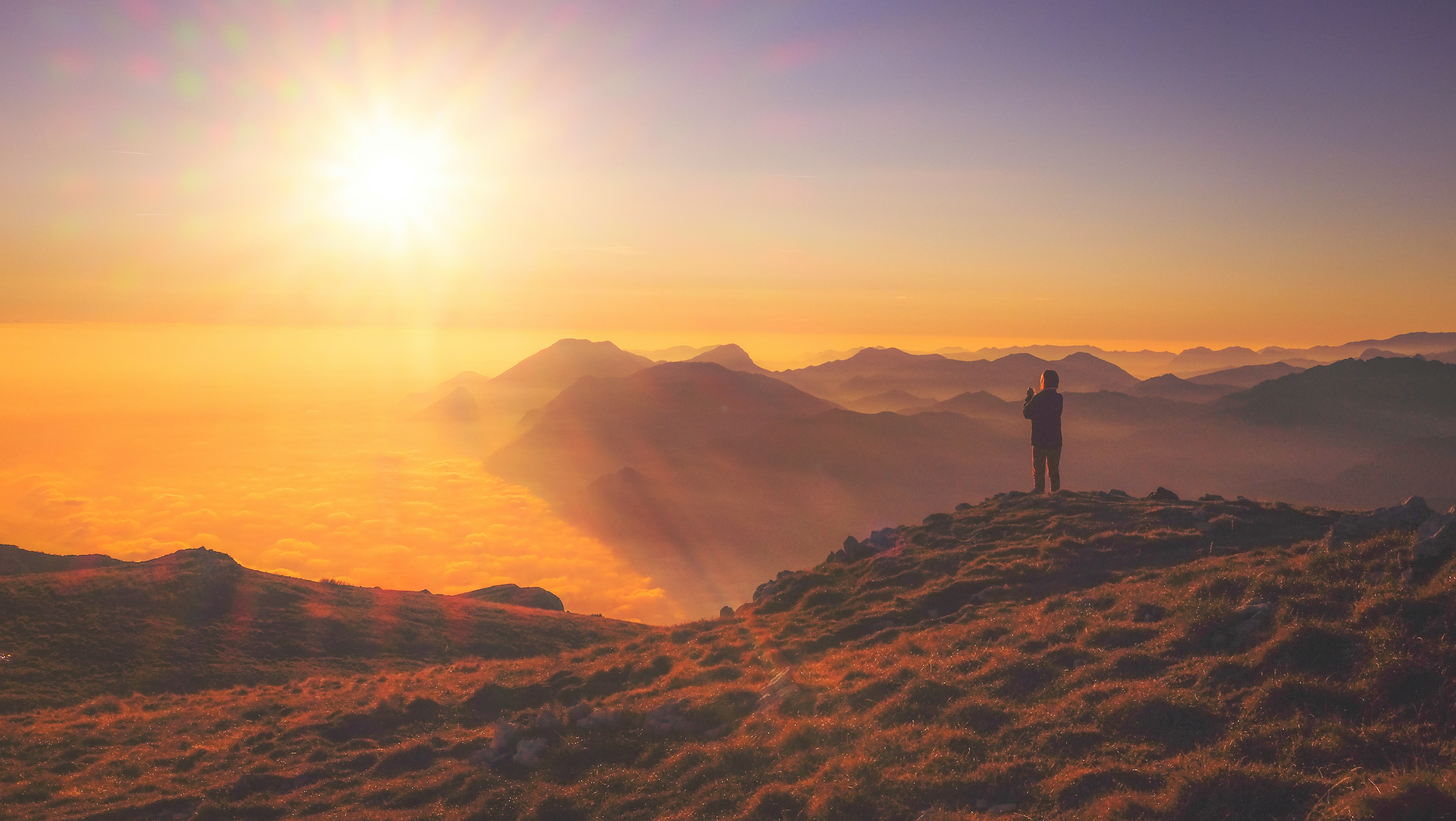 person standing on mountain